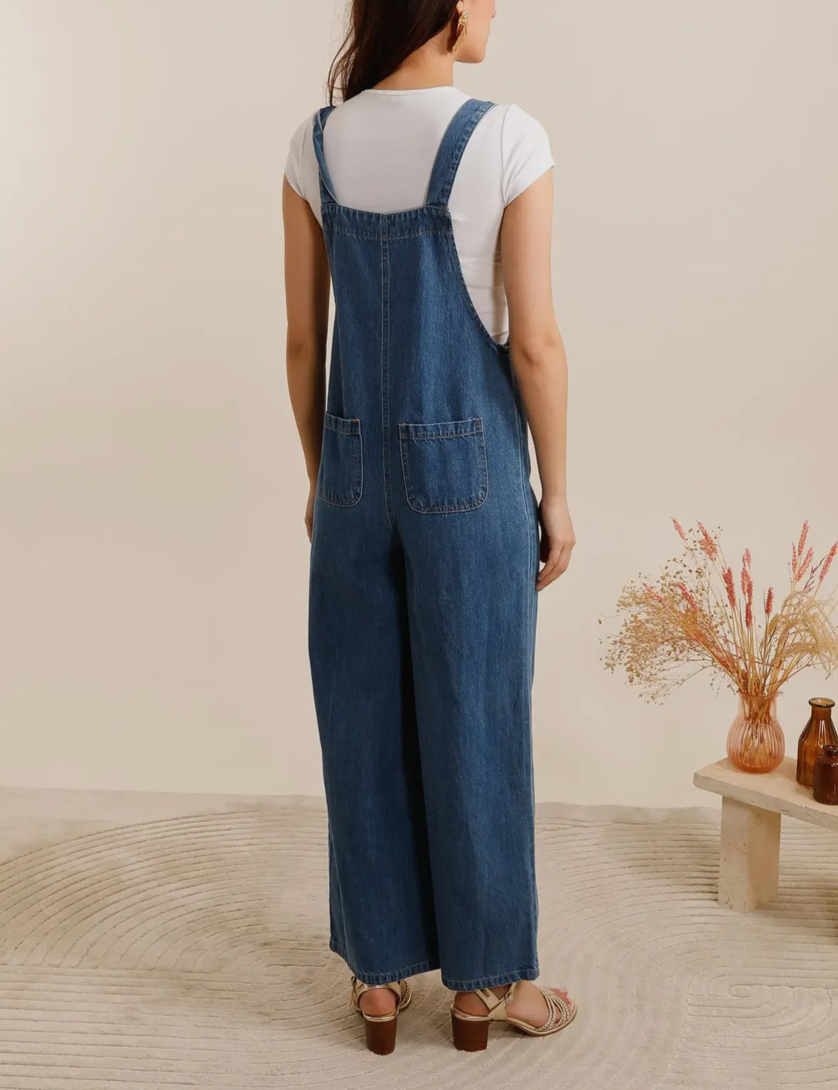 Salopette di jeans blu scuro a gamba ampia